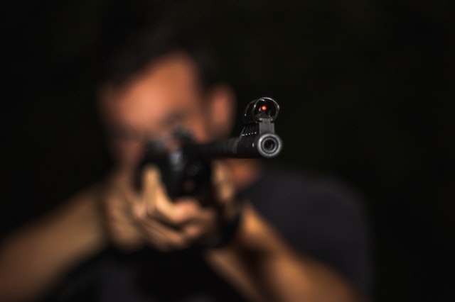 A minor points a firearm