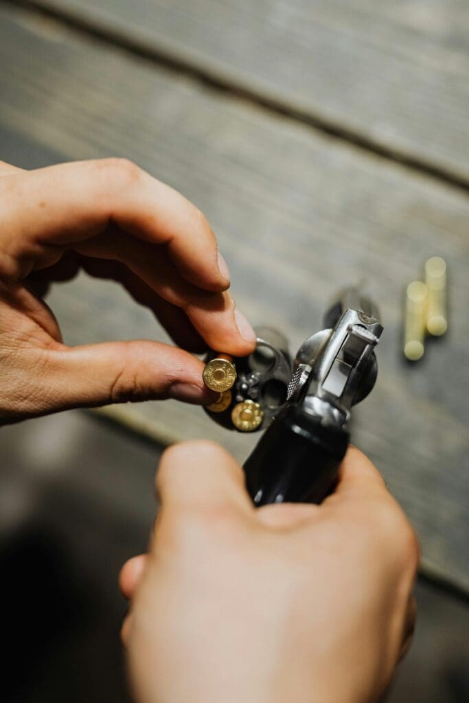 A parent holds a firearm