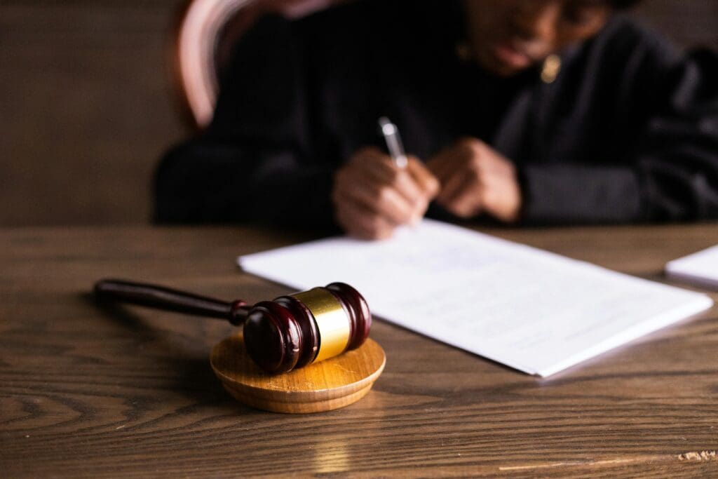 A judge signs a document.